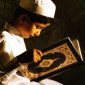 a boy reading the quran